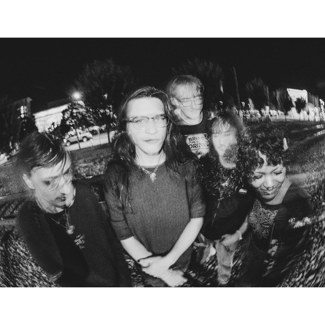 Blurry black and white photo the five members of Sunshower.